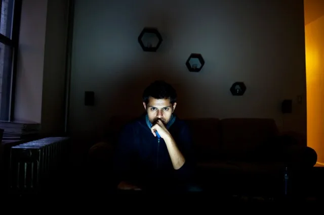 Bloggers illuminated by their screens